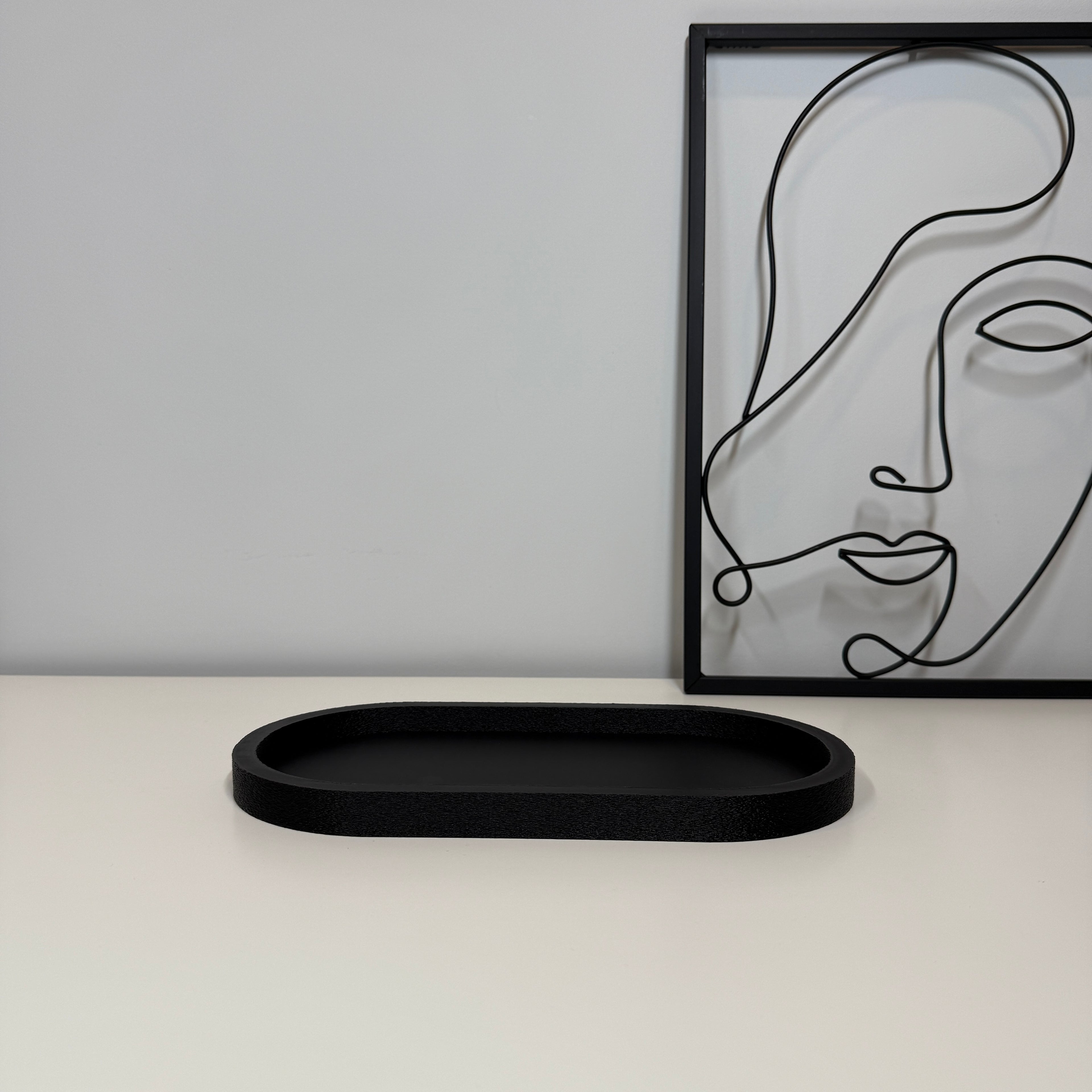 Ovalus dekoratyvinis padėkliukas 27x13 cm iš PLA plastiko, minimalistinis interjero akcentas